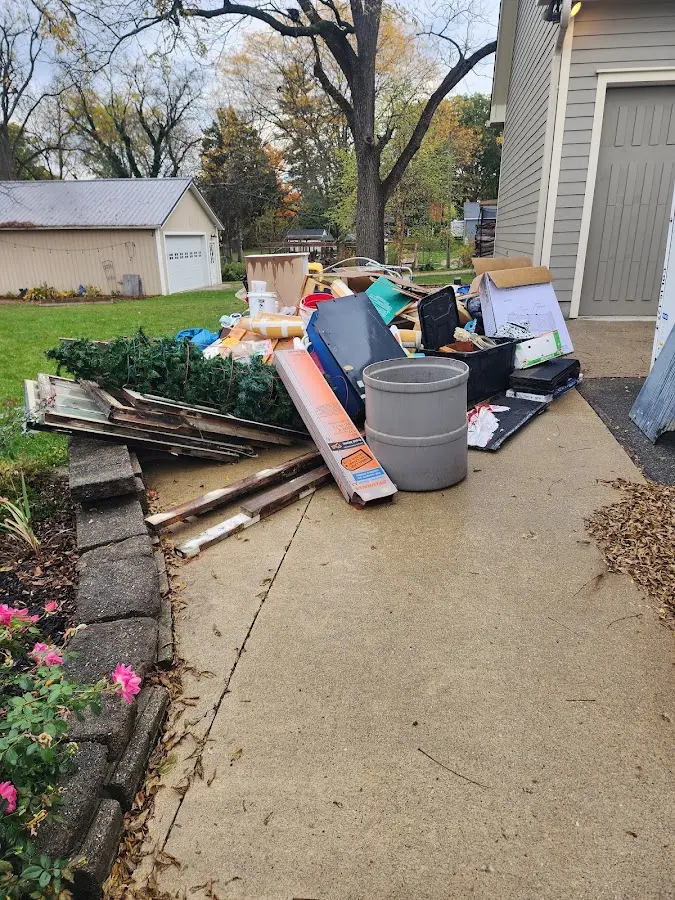 Dumpster being loaded with debris for 3 Yard Dumpster Rental in Bethany